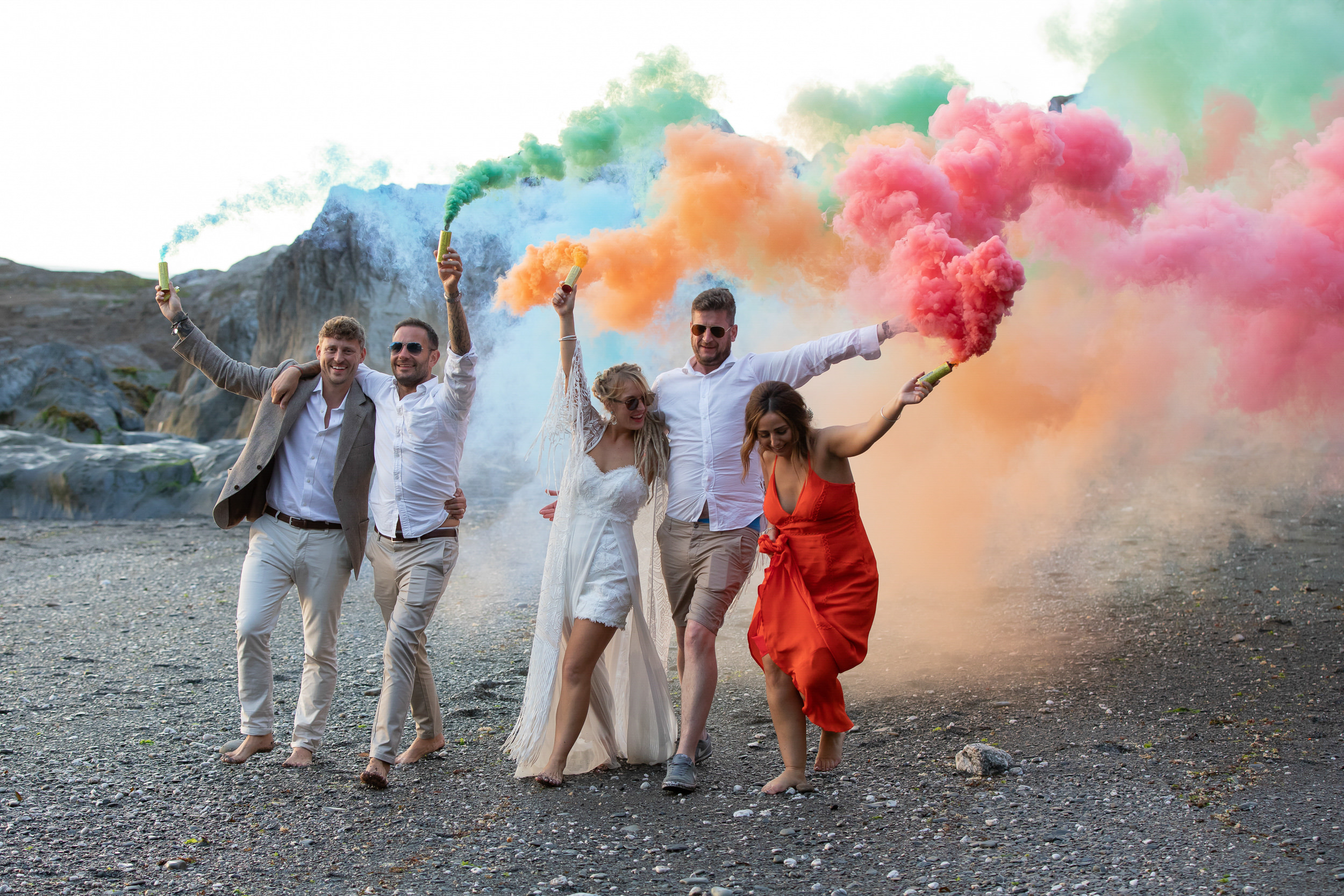 Bridal Party with Smoke Bombs at Tunnels Beaches Wedding venue in Devon