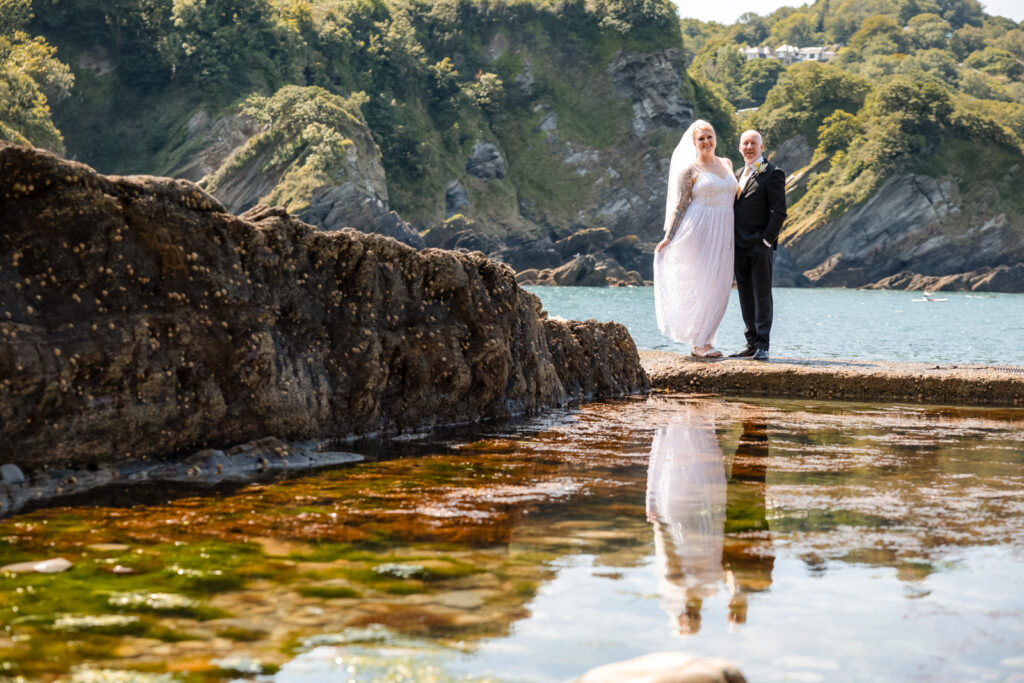 Bride and Groom Next to Rock Pool