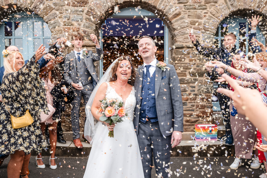 Bride and Groom Under Confetti