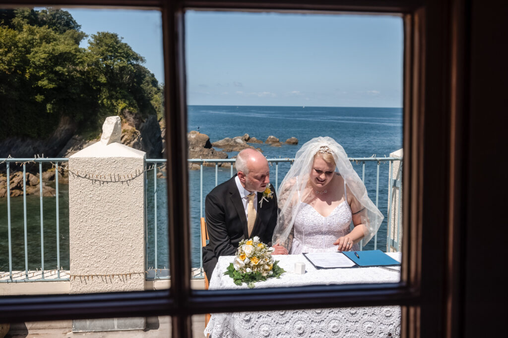 Couple Signing Wedding Register